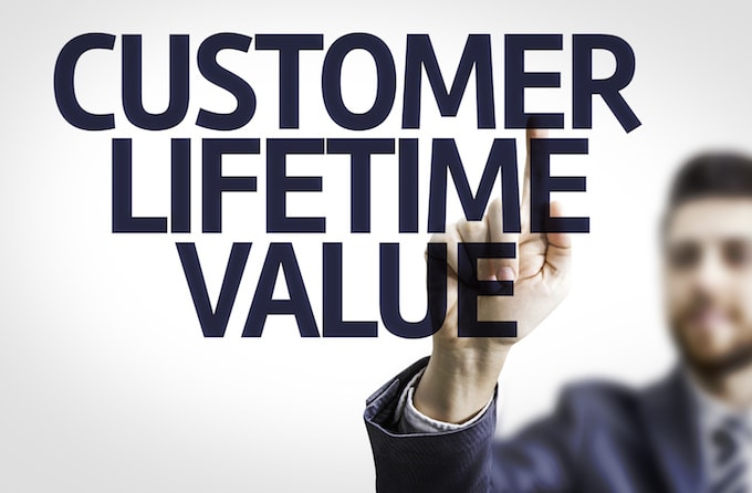 Business man pointing the text: Customer Lifetime Value